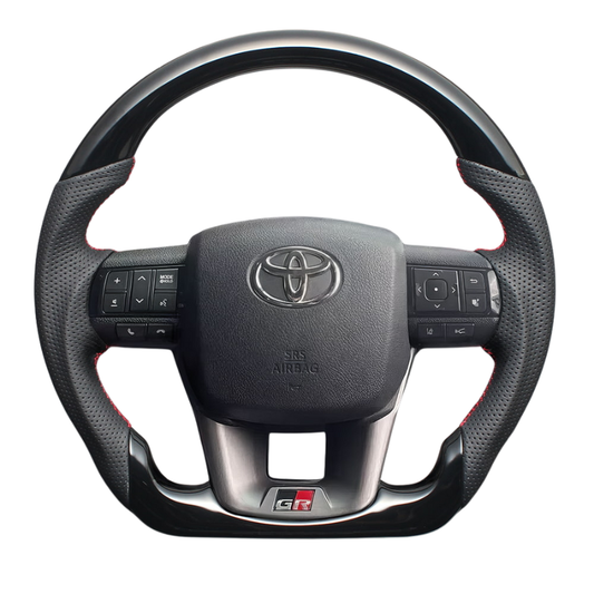 高品質の証ユーロステッチ採用 (ピアノブラックxレッドステッチ) 純正交換ガングリップステアリング ランクル   70系 R5/11- 現行モデル LS219