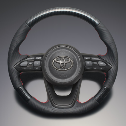 高品質の証ユーロステッチ採用 (カーボン調xレッドステッチ) 純正交換ガングリップステアリング ヤリス MXP10系 R2/2- LS196